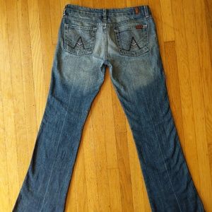 Boot cut jeans with studded pockets Size 29x34.5